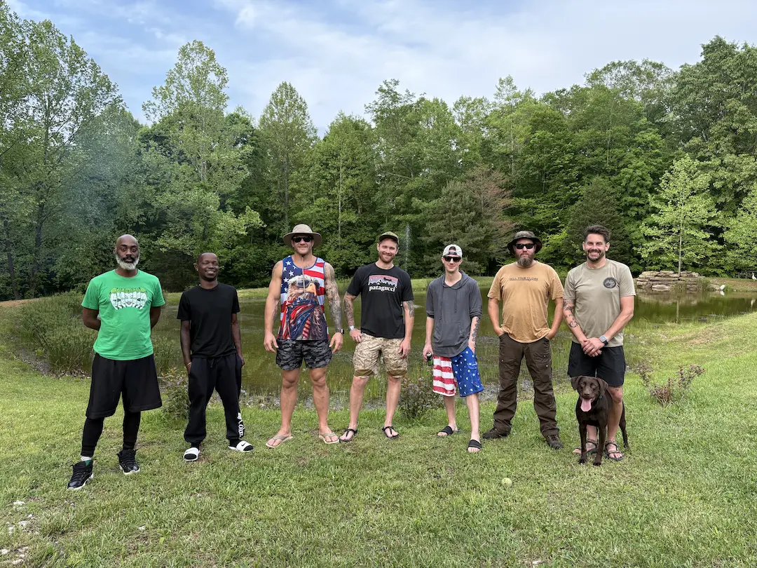 A team of Warrior Ridge veterans together by a pond